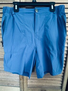 Pudolla women’s blue quick dry shorts. 7 inch inseam.  Like new